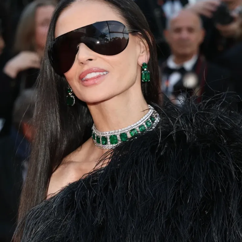 <p>Demi Moore at the 2026 Cannes Film Festival in an emerald and diamond choker and matching earrings from the Chopard Red Carpet collection</p>