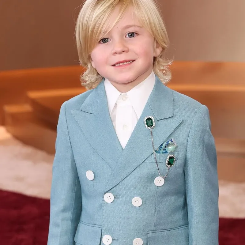 <p>Six-year-old Duke McCloud stole the show with a double emerald lapel pin pinned to his blue suit</p>
