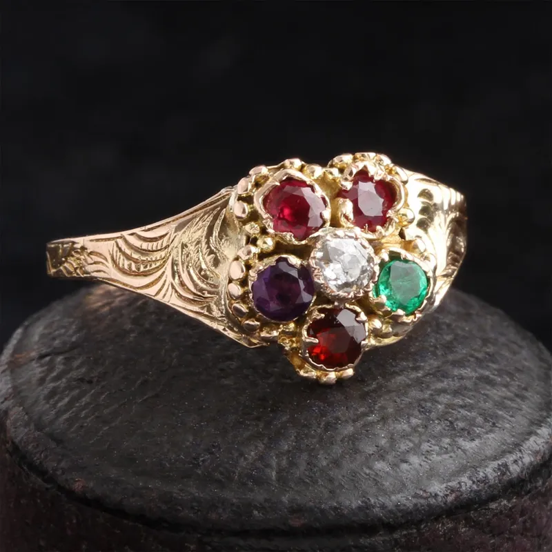 <p>Georgian Pansy ‘Regard’ Acrostic Ring 14k gold (tests), 2 2.8 x 2.3mm rubies (one is a replacement), 2.5mm old mine cut diamond, 2.6 x 2.1mm emerald, 2.5mm garnet, 2.8 x 2m5nn amethyst, c. 1820</p>