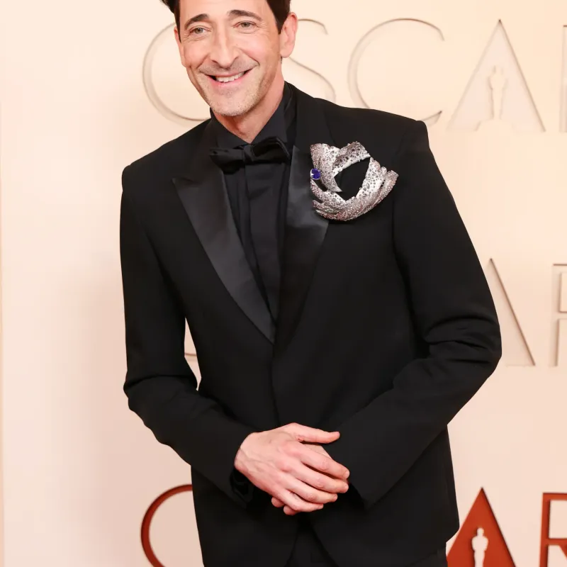 <p>Adrien Brody wears Elsa Jin Studio brooch</p>
