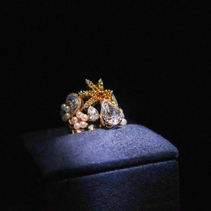 <p>A ring with a large pear-shaped diamond, opal, coloured gemstones and micro pearls from the Belle Dior High Jewellery collection</p>
