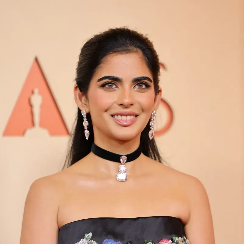 <p>Isha Ambani wears a black ribbon choker from Lorraine Schwartz set with a diamond pendant</p>

