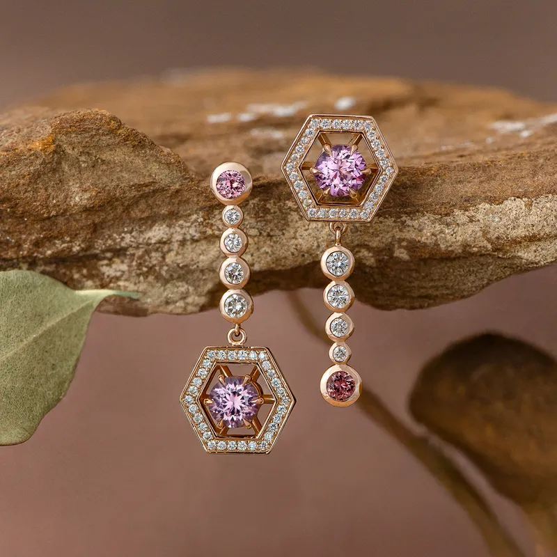 <p>A pair of 18k rose gold earrings with two pink Malaya garnets totalling 1.16 carats, two further Malaya garnets totalling 0.24 carats, and 68 diamonds for a further 0.49 carats </p>
