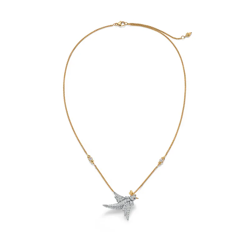 <p>Bird on a Rock by Tiffany pendant in platinum and 18k yellow gold with diamonds and sapphire accents</p>