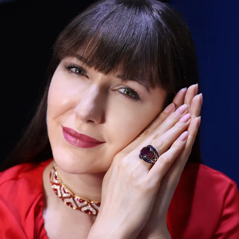 <p>Katerina wears the Marina B Irreversible high jewellery choker and Ezia ring set with 4.14ct emerald cut amethysts, 4.02ct emerald cut pink tourmalines and 4.14ct buff top pink amethysts in 18k yellow gold</p>
