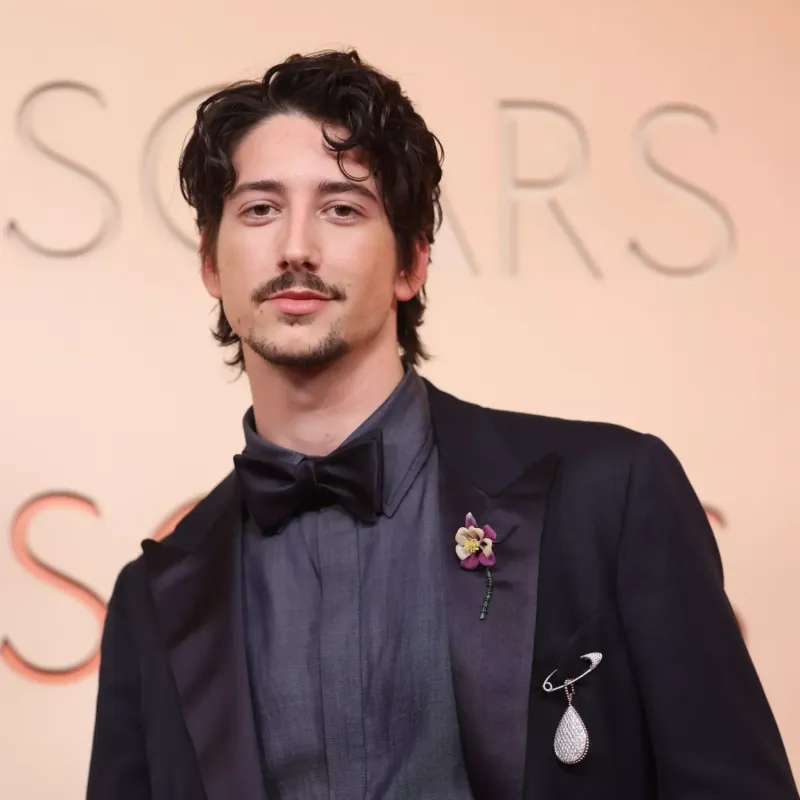 <p>Milo Manheim wears Boucheron Serpent Bohème XXL motif brooch from the transformable medallion in white gold, set with diamonds, Quatre Radiant Edition wedding band in white gold and Quatre Black Edition bracelet in white gold, set with diamonds and black PVD</p>
