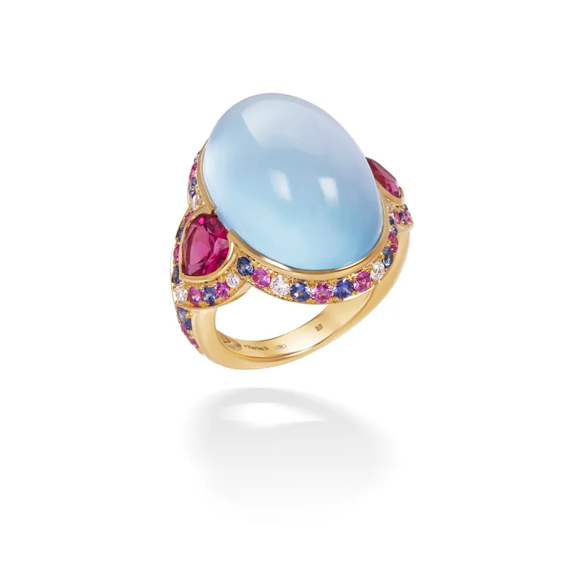 <p>Marina B Pacila high jewellery ring, set with a 30.69ct sky blue topaz cabochon, pear-shaped rubellites and pavé-set sapphires and diamonds in 18k yellow gold</p>
