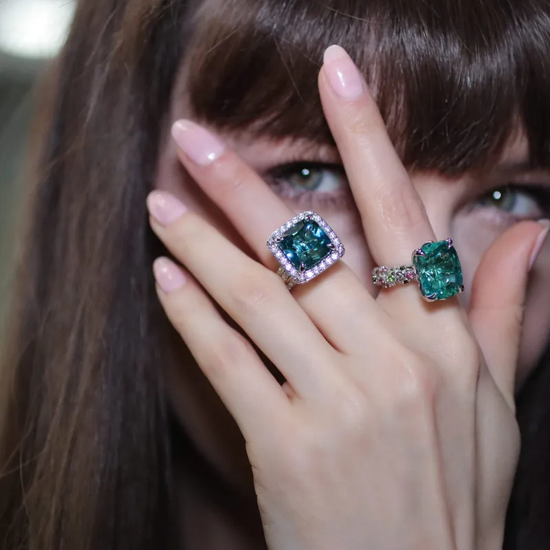 <p>Katerina Perez wears coloured gemstone cocktail rings set with lagoon tourmalines and diamonds</p>
