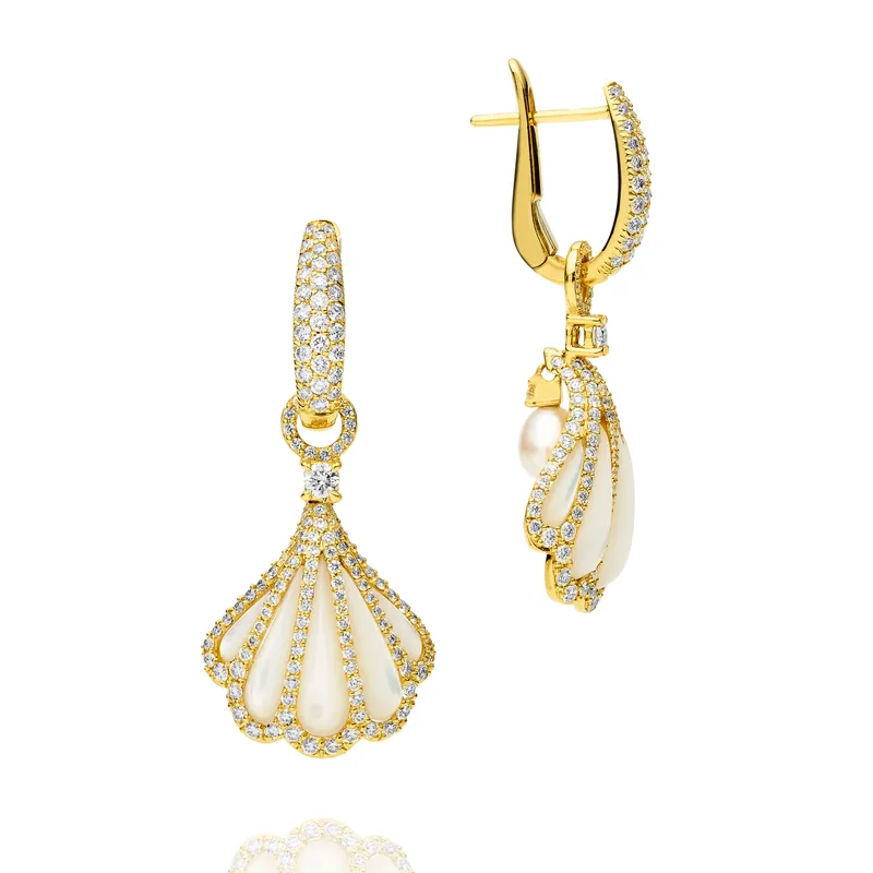  The Clam Shell earrings in 18k yellow gold, featuring hand-carved mother-of-pearl and diamond shells and a Keshi pearl suspended from the reverse of the clamshell 