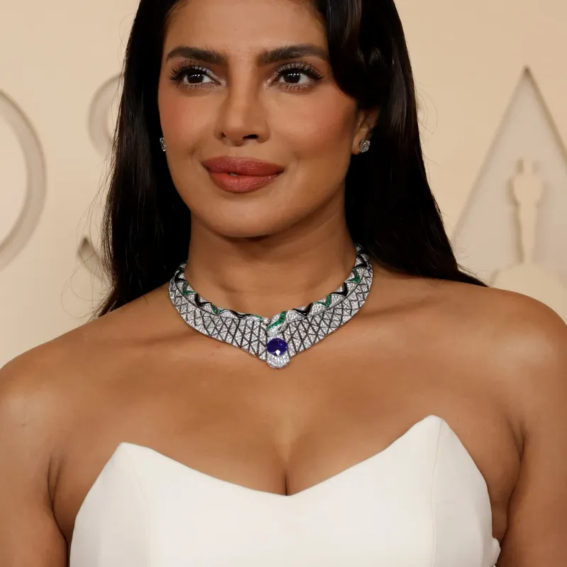 <p>Priyanka Chopra wears Bulgari Serpenti high jewellery necklace in white gold, set with onyx elements, 1 cushion sapphire, 1 round diamond, 2 buff-top sapphires, 130 buff-top emeralds and pavé-set diamonds, high jewellery ring in platinum, set with 1 emerald shape diamond, 14 fancy diamonds and pavé-set diamonds and high jewellery earrings in platinum, set with 2 cushion diamonds</p>
<p>&nbsp;</p>
