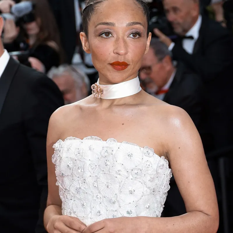 <p>Actress Ruth Negga wears another Chopard High Jewellery look, this time a diamond-set brooch attached to a satin choker</p>