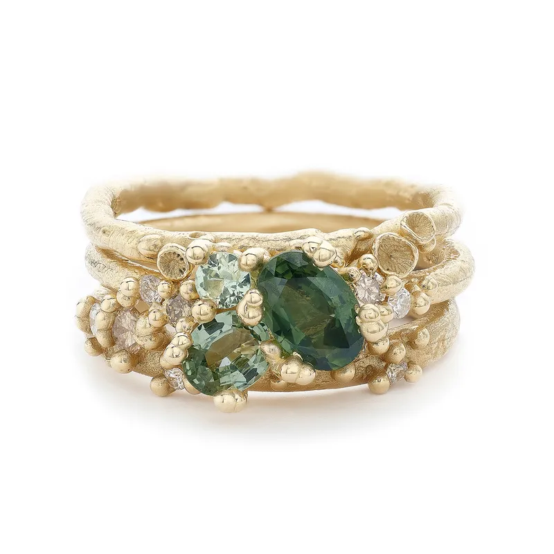 <p>Green sapphire and diamond encrusted ring stack</p>
