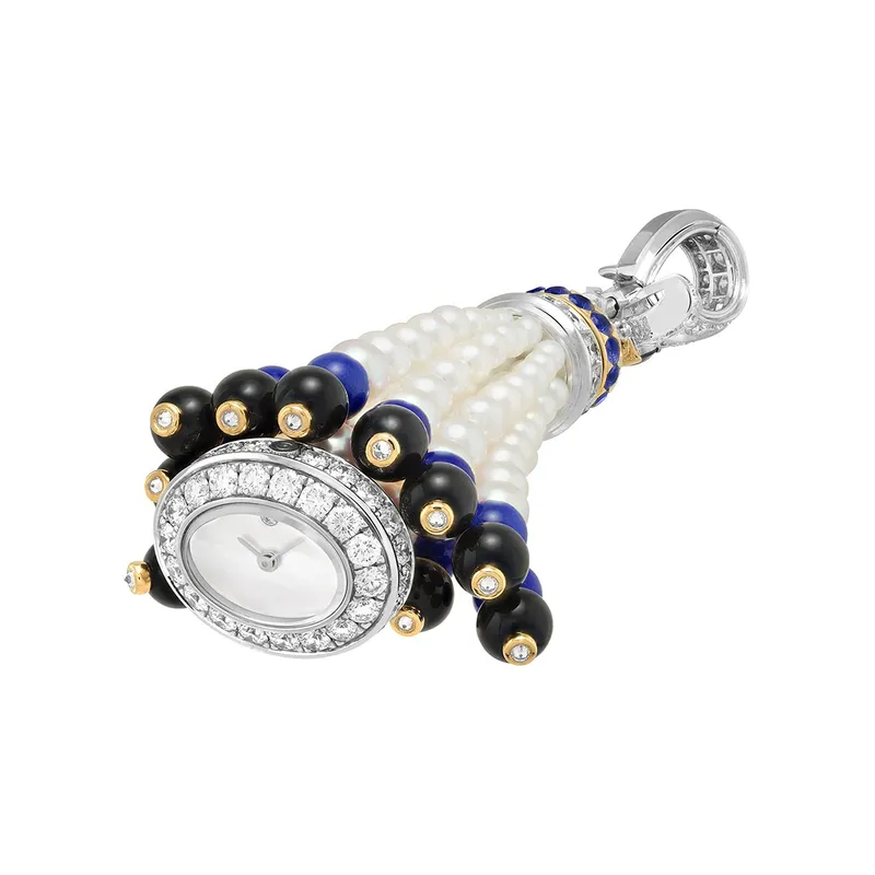 <p>Pompon Leila includes a secret watch hidden in the base of the tassel</p>