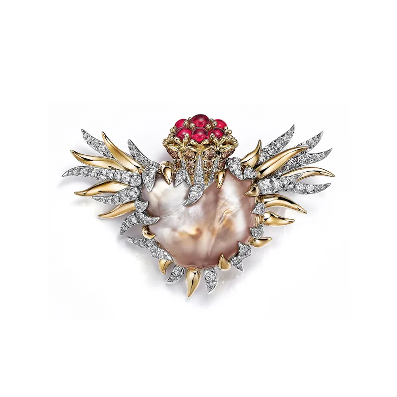<p>Tiffany &amp; Co. Bird on a Pearl high jewellery brooch set with a light orangy brown and white baroque natural saltwater pearl of 36.79 carats, Fancy Brown diamonds, cabochon rubellites and white diamonds</p>
