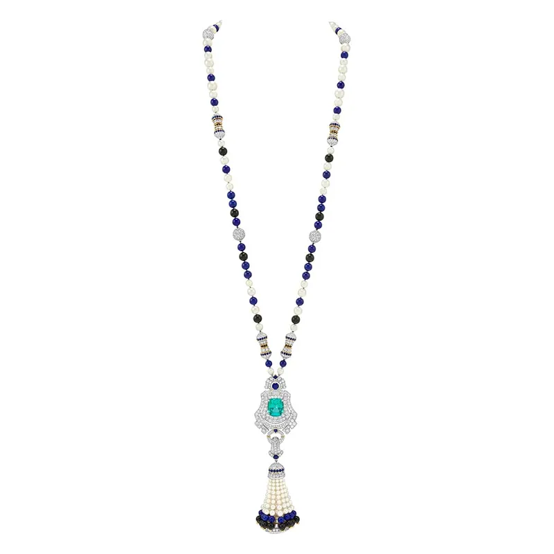 <p>Pompon Leila transformable long necklace watch with a detachable clip in white gold, yellow gold and platinum, with tourmaline, sapphires, black spinels, onyx, lapis lazuli, pearls, mother-of-pearl, diamonds and a quartz movement</p>