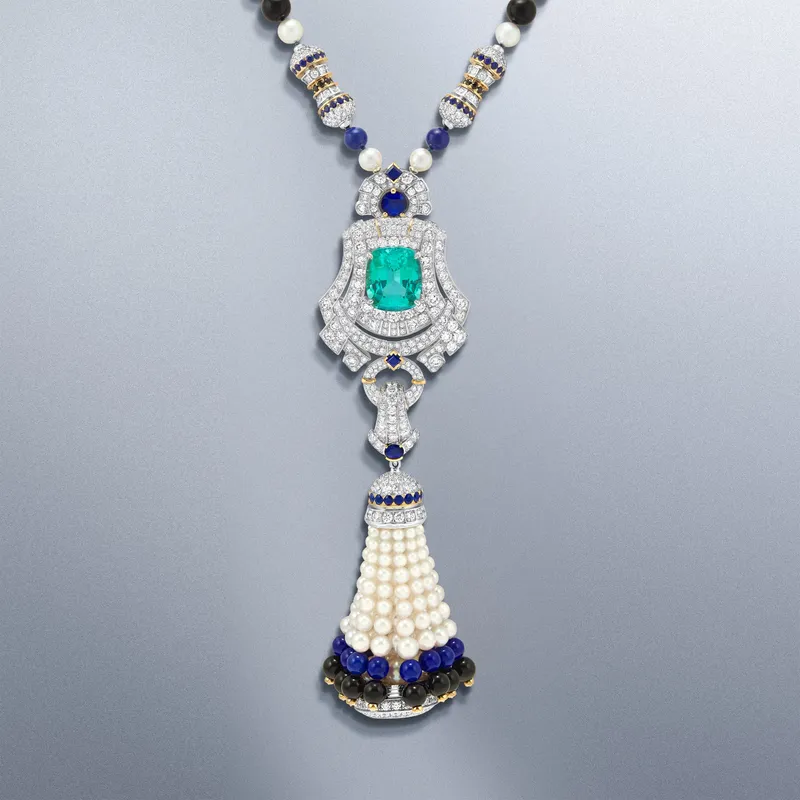<p>Pompon Leila transformable long necklace watch with a detachable clip in white gold, yellow gold and platinum, with tourmaline, sapphires, black spinels, onyx, lapis lazuli, pearls, mother-of-pearl, diamonds and a quartz movement</p>
