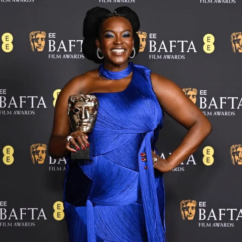 <p>Wunmi Mosaku looked sensational in a royal blue gown paired with Moussaieff diamond earrings</p>