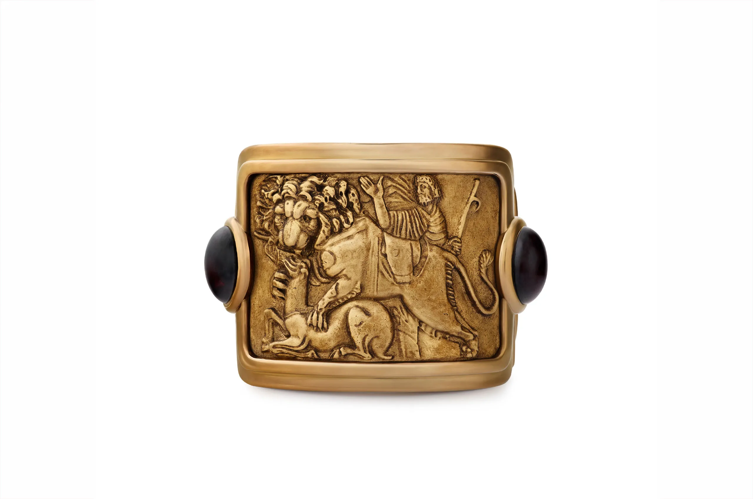Sabyasachi wrist cuff in 18kt and 22kt gold with garnet cabochons and brilliant-cut brown diamonds, inspired by a 3rd-century Roman sculpture.