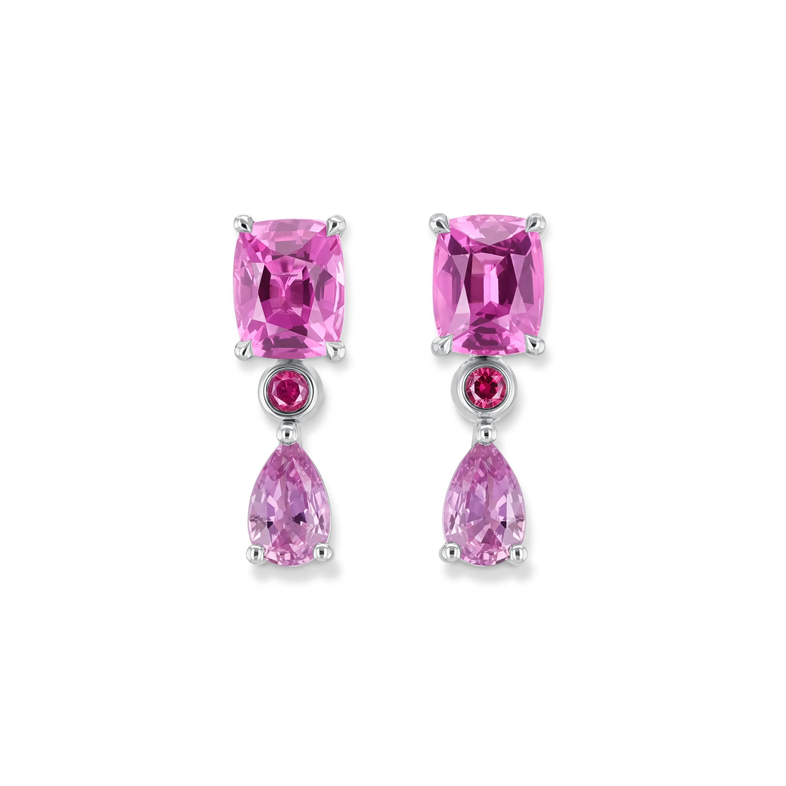 <p>House of Gübelin earrings with two pink spinels from Tanzania each weighing exactly 1.10 carats, alongside cabochon-cut Gübelin rubies from Greenland and two pear-shaped lilac sapphires</p>
