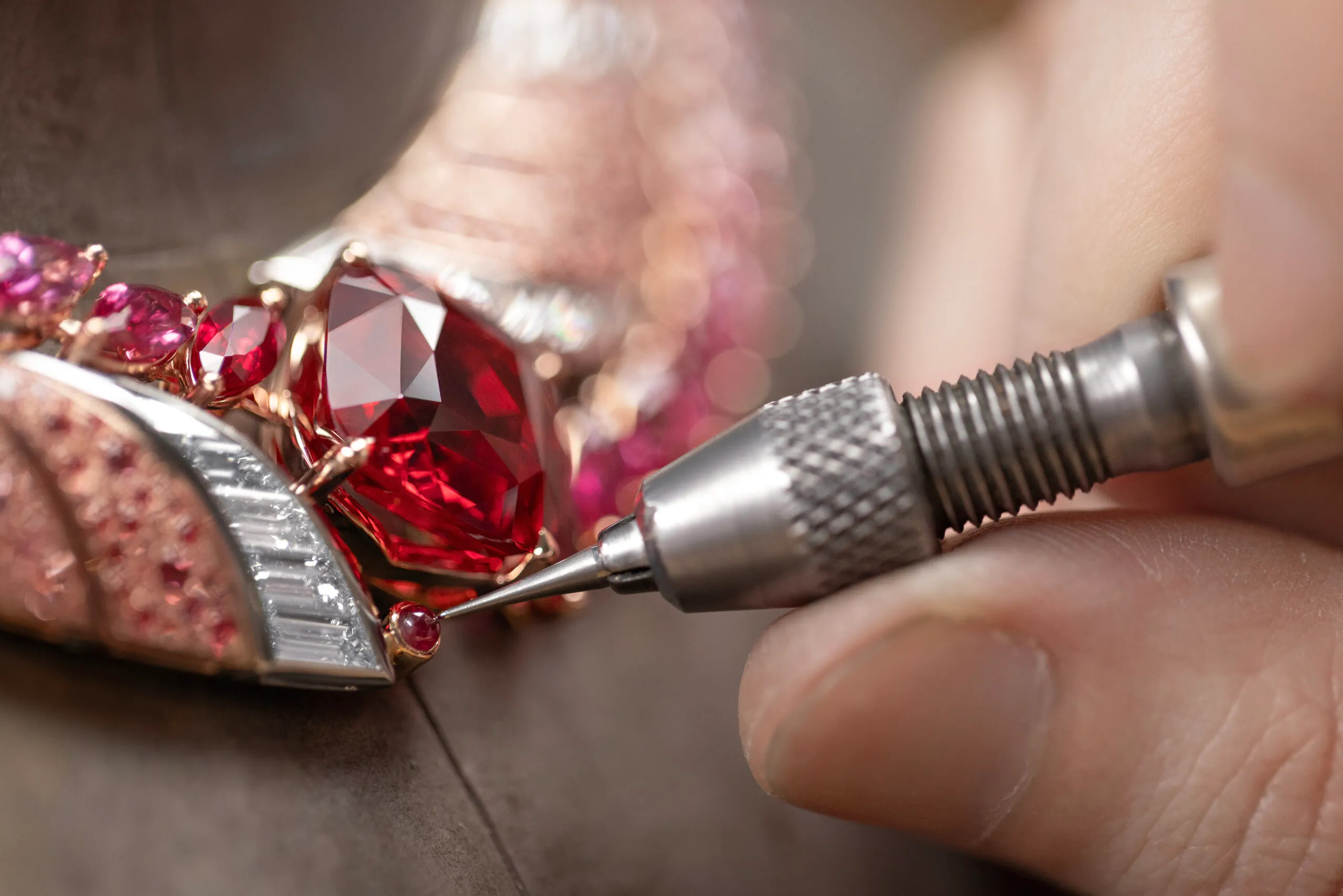 <p>Adding the iconic Gübelin cabochon ruby to the Tanzanian Sunrise High Jewellery necklace with a 22 carat cushion-shaped red spinel from Tanzania, baguette-cut diamonds, orange and rose-coloured spinel pavé, and marquise-cut spinels, sapphires and rubies set in 18k rose gold and platinum </p>
