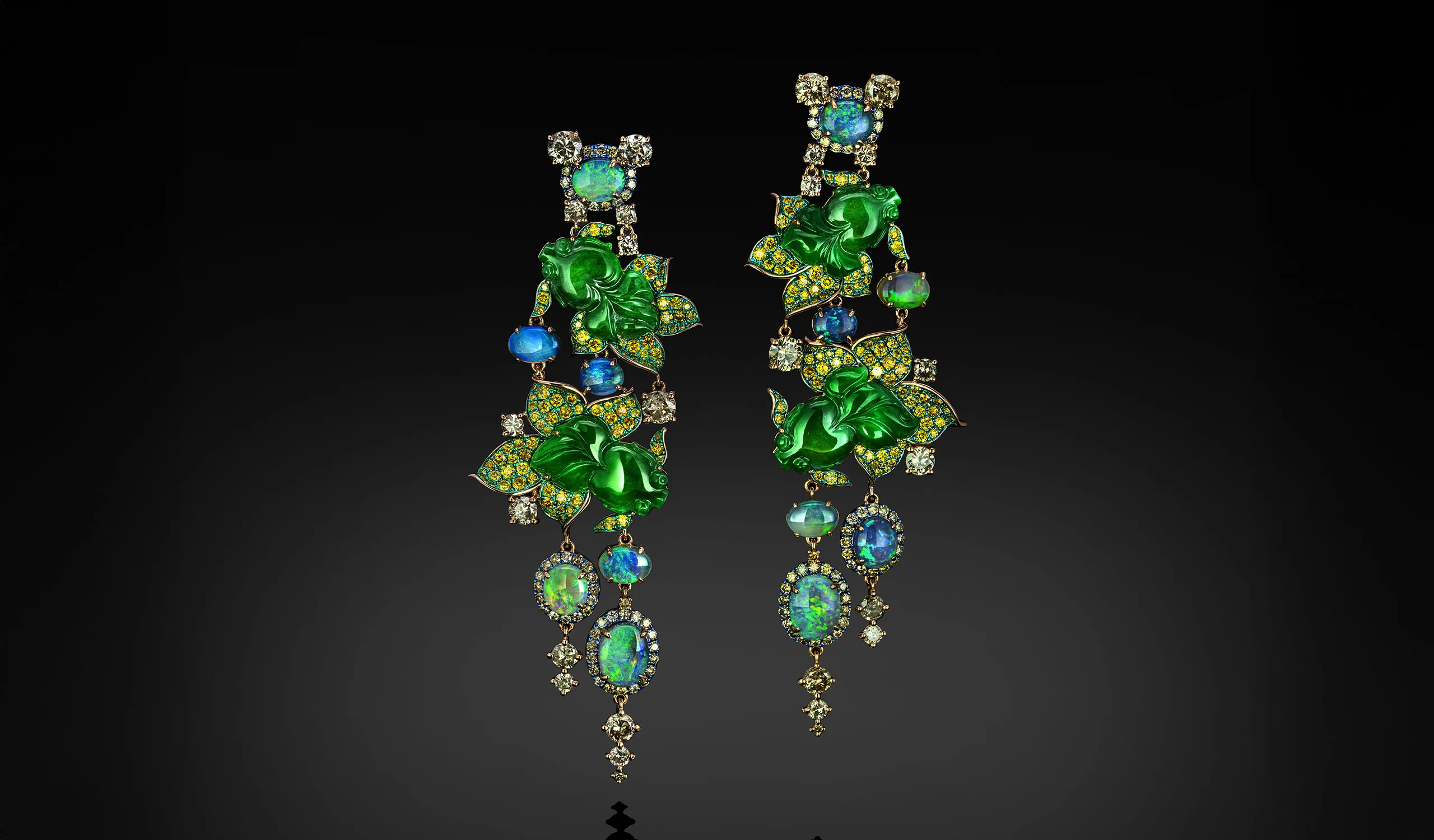 <p>Austy Lee The Gold Fishes Plays earrings from The Jade Dynasty collection with Burmese green jades, Australian semi-black opals, fancy yellow diamonds and white diamonds set in 18k yellow gold </p>
