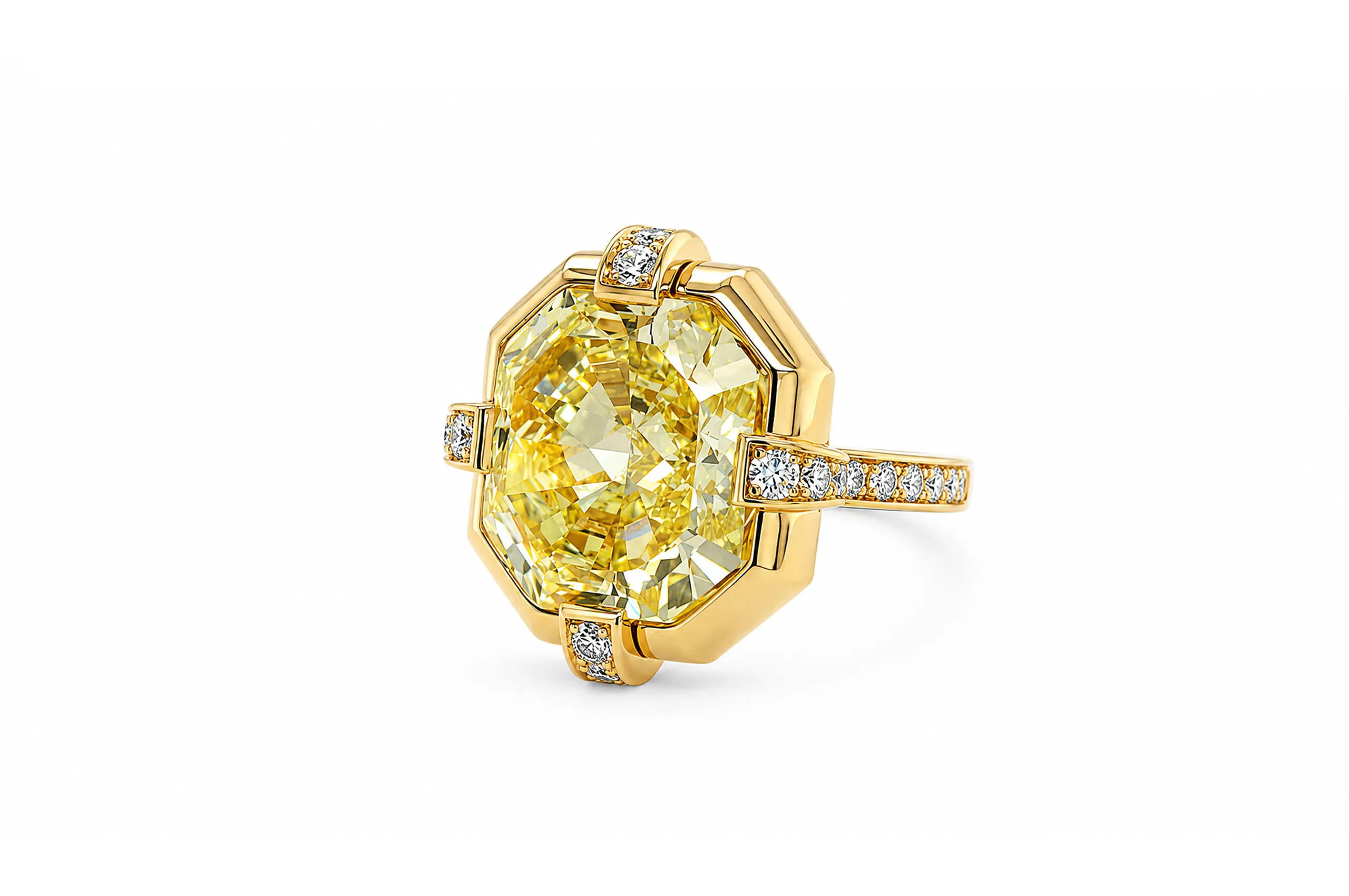 Bayco ring set with a 10.04-carat radiant-cut Fancy Intense Yellow diamond in a sculptural octagonal 18k yellow gold setting and pavé white diamonds