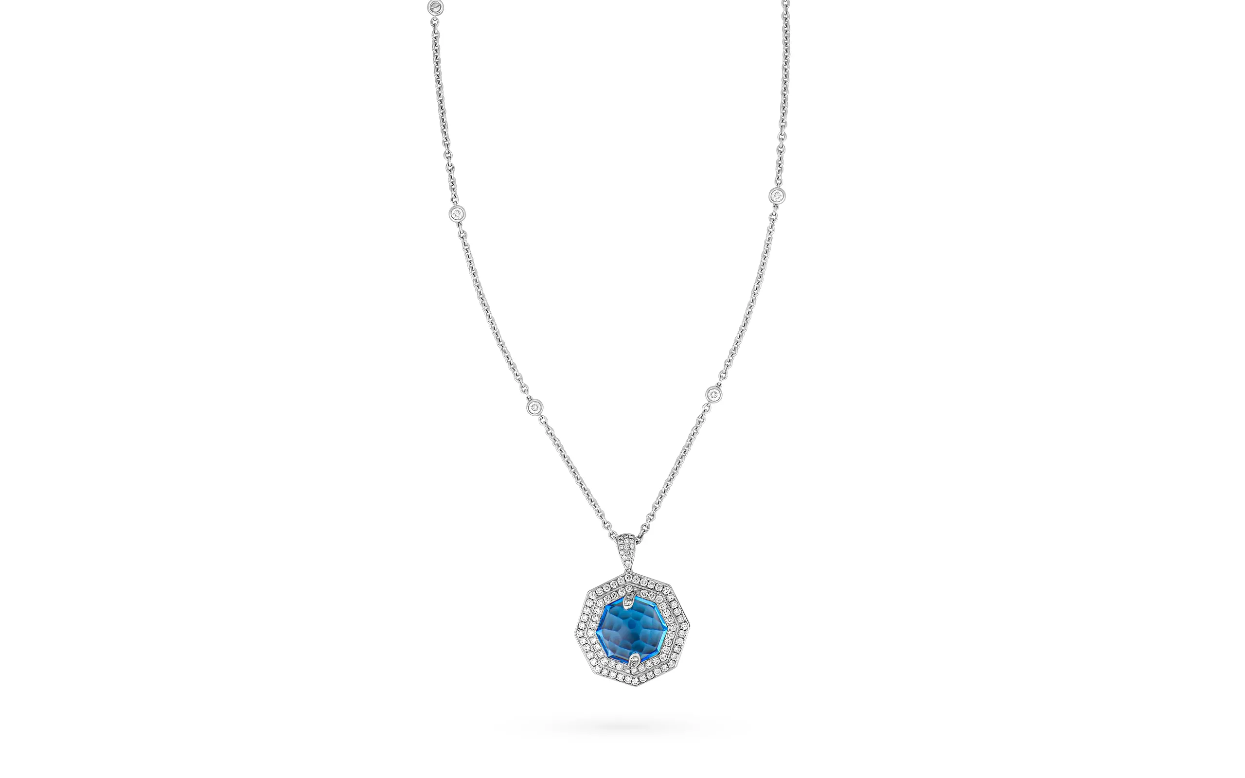 <p>AKANO Double Halo Topaz pendant necklace with a 16.4-carat topaz, encircled by a 1.87-carat diamond double halo, set in 18K gold. Part of the Hexagon Gemstone collection</p>
