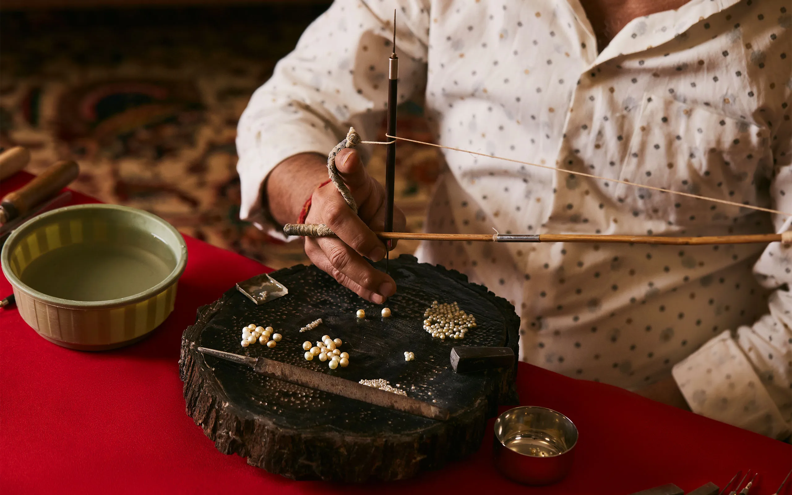 <p>The delicate art of drilling holes in Al Mahmood’s natural pearls</p>
