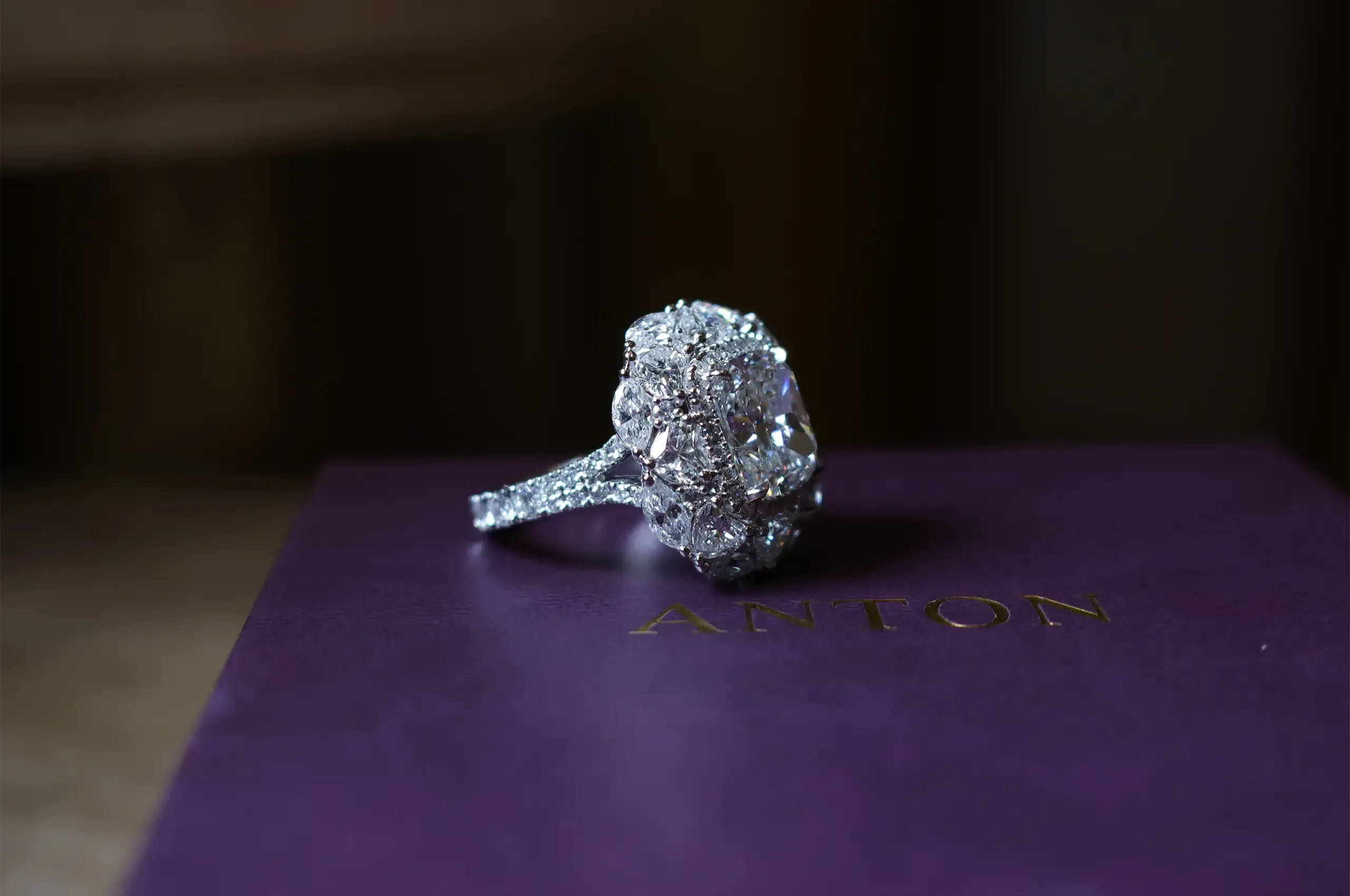 The 5.23ct cushion-cut centre diamond is surrounded by a sculptural halo of heart, marquise-cut and round diamonds