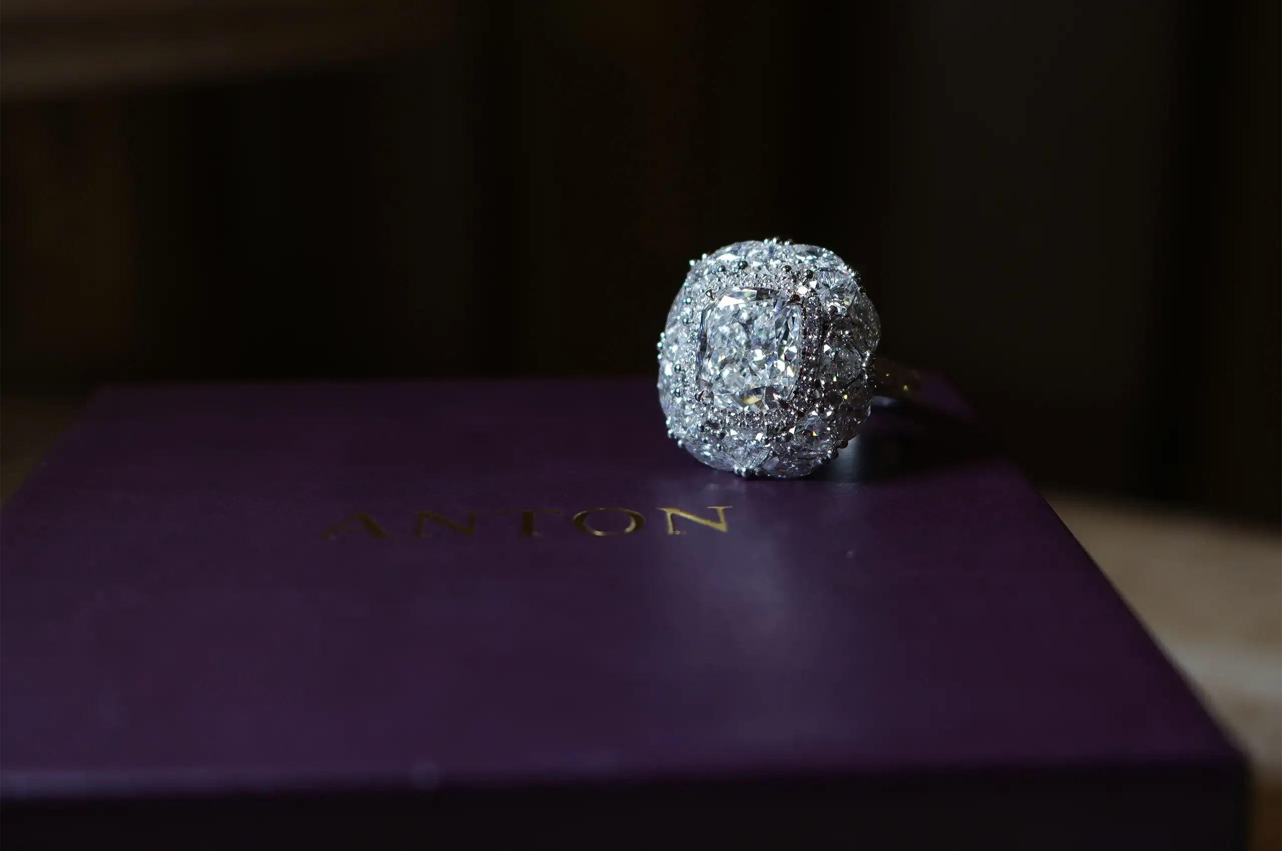 Eight heart-shaped and eight marquise-cut diamonds create the ring’s mixed fancy-cut halo, interspersed with round diamonds