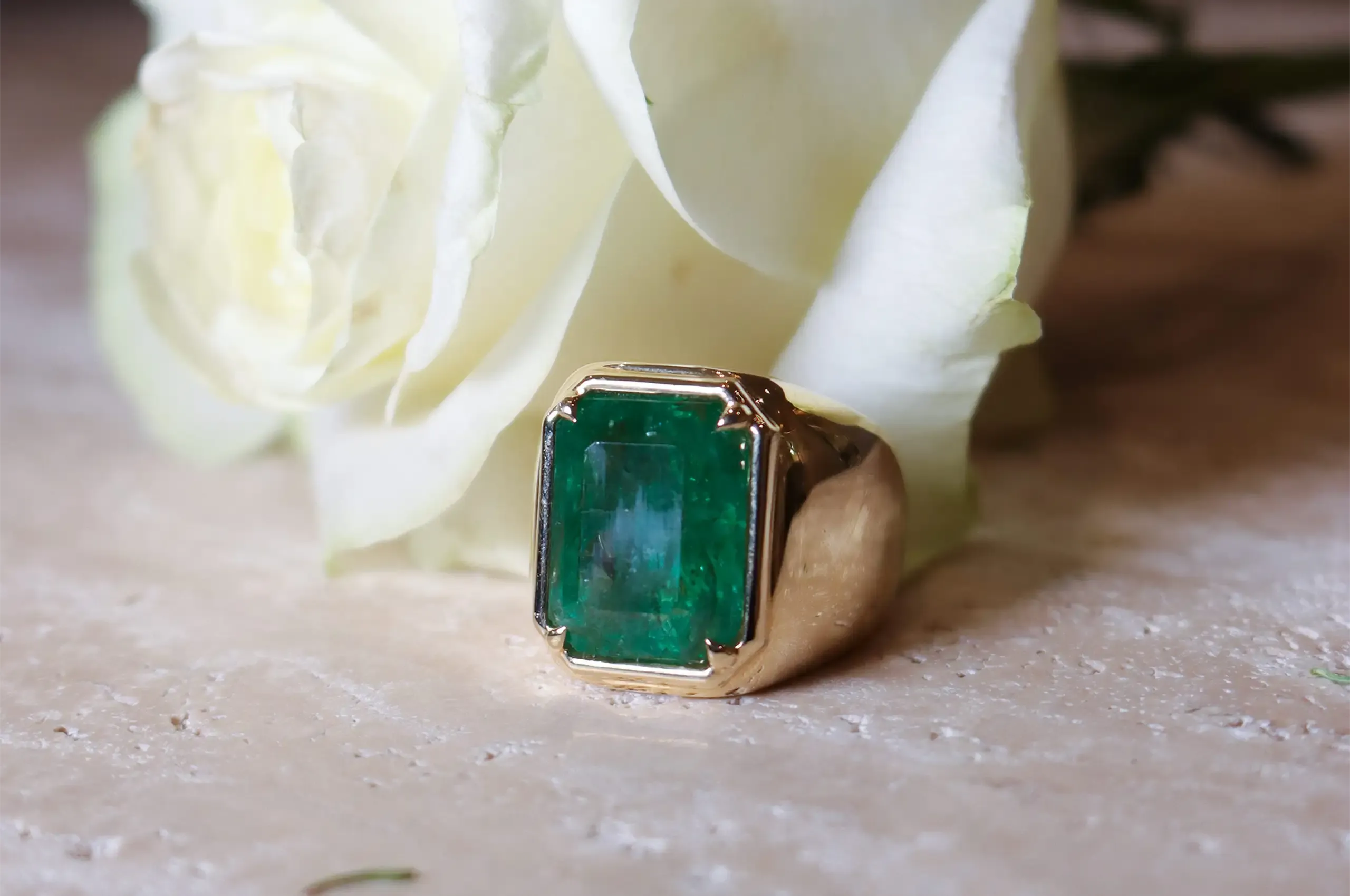 The Luminous Octagon Emerald Ring by ANTON Jewellery features a 15.38ct natural emerald set in 18k yellow gold