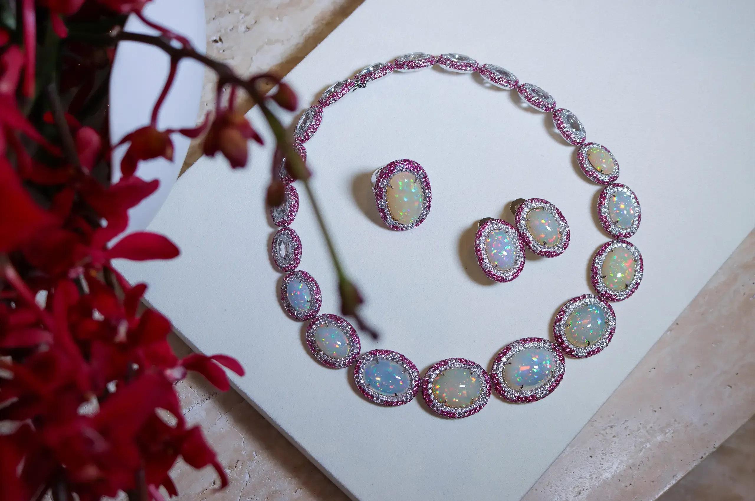 The Rock Candy® collier, dress ring and earrings by Anton Jewellery bring together luminous Ethiopian opals with pink and white sapphires and pink spinels