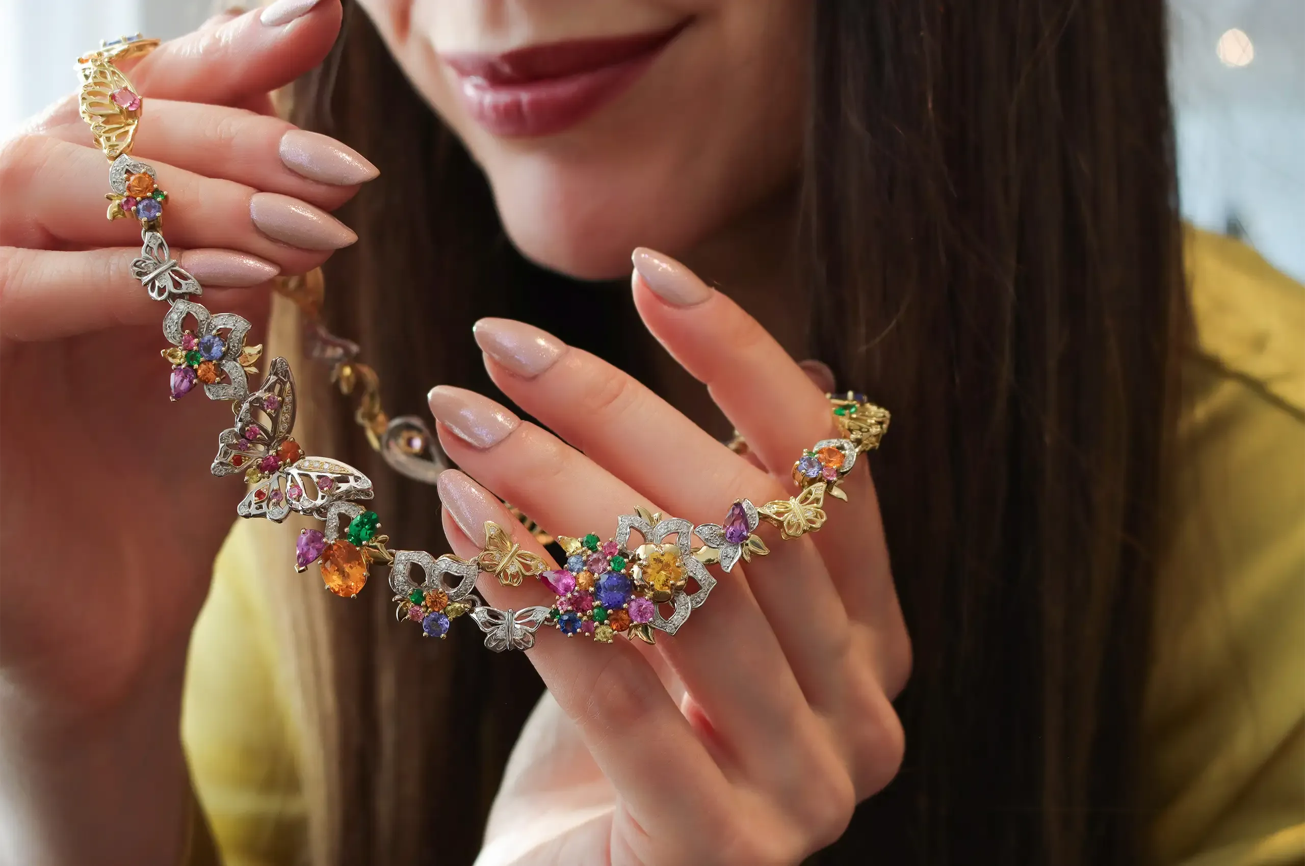 A closer look at the Artisans Bespoke Jewellers Borboleta necklace with yellow, pink, blue and purple sapphires, tanzanites, tsavorite garnets, mandarin garnets, spinels and 1.20 carats of diamonds, set in 18k yellow and white gold 