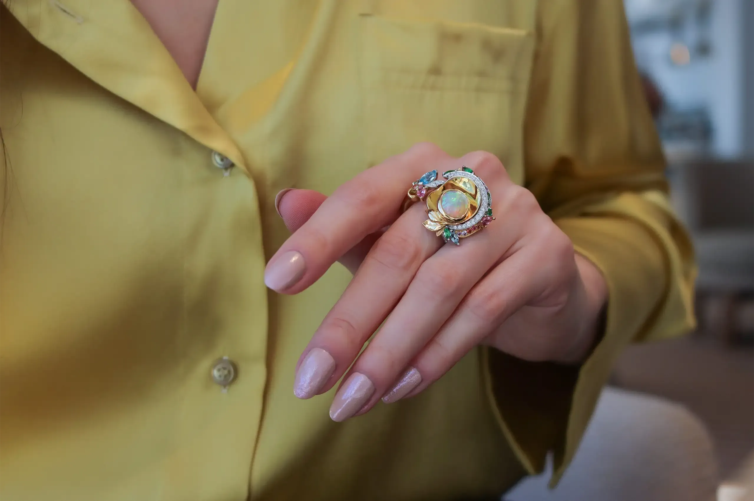 A closer look at the careful composition of coloured gemstones in Artisans Bespoke Jewellers’ award-winning Khroma ring, set with a crystal opal cabochon from Lightning Ridge, Australia, zircon, sapphire, garnet, spinel and diamonds in 18k yellow and white gold 