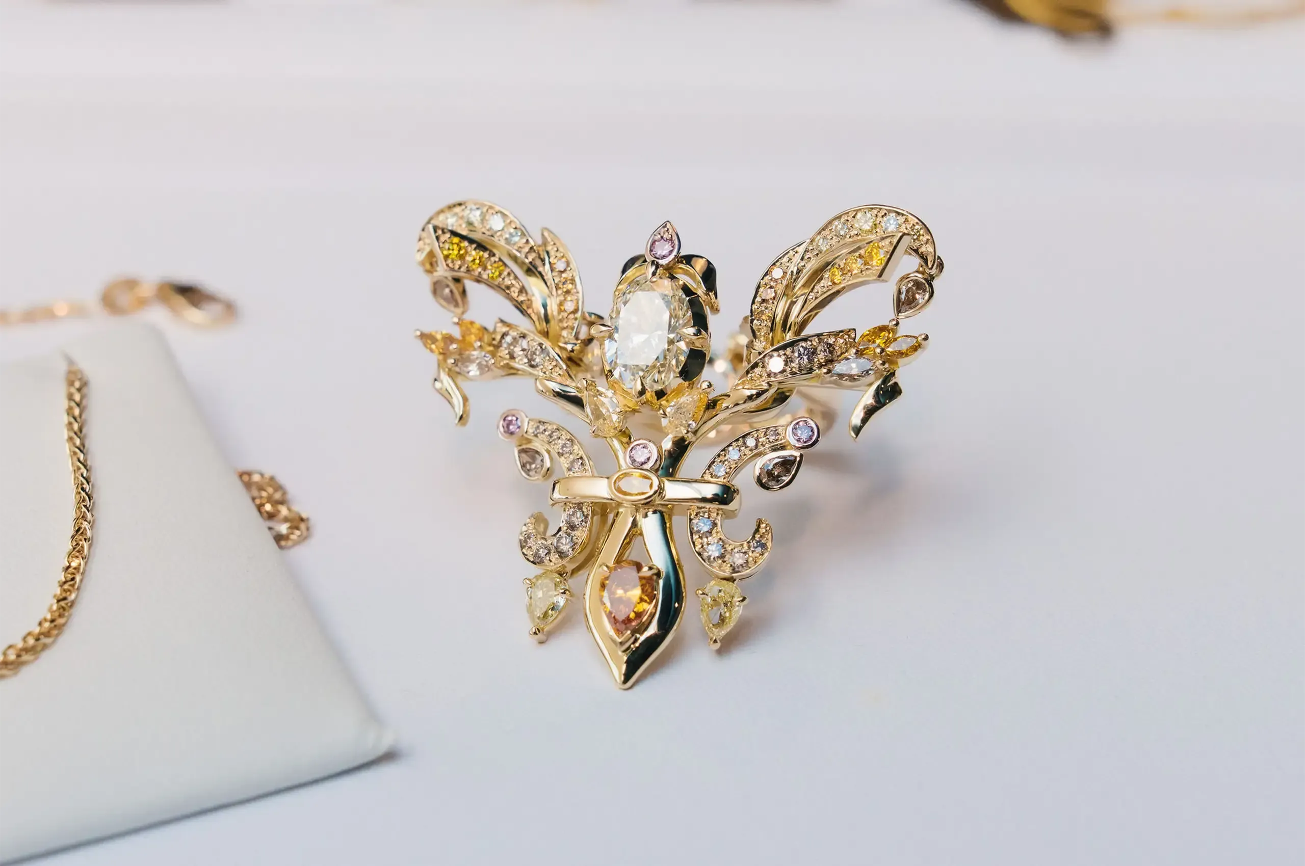 Set with natural fancy coloured diamonds inspired by the colours of an Australian outback sunset, the ring transforms into a pendant