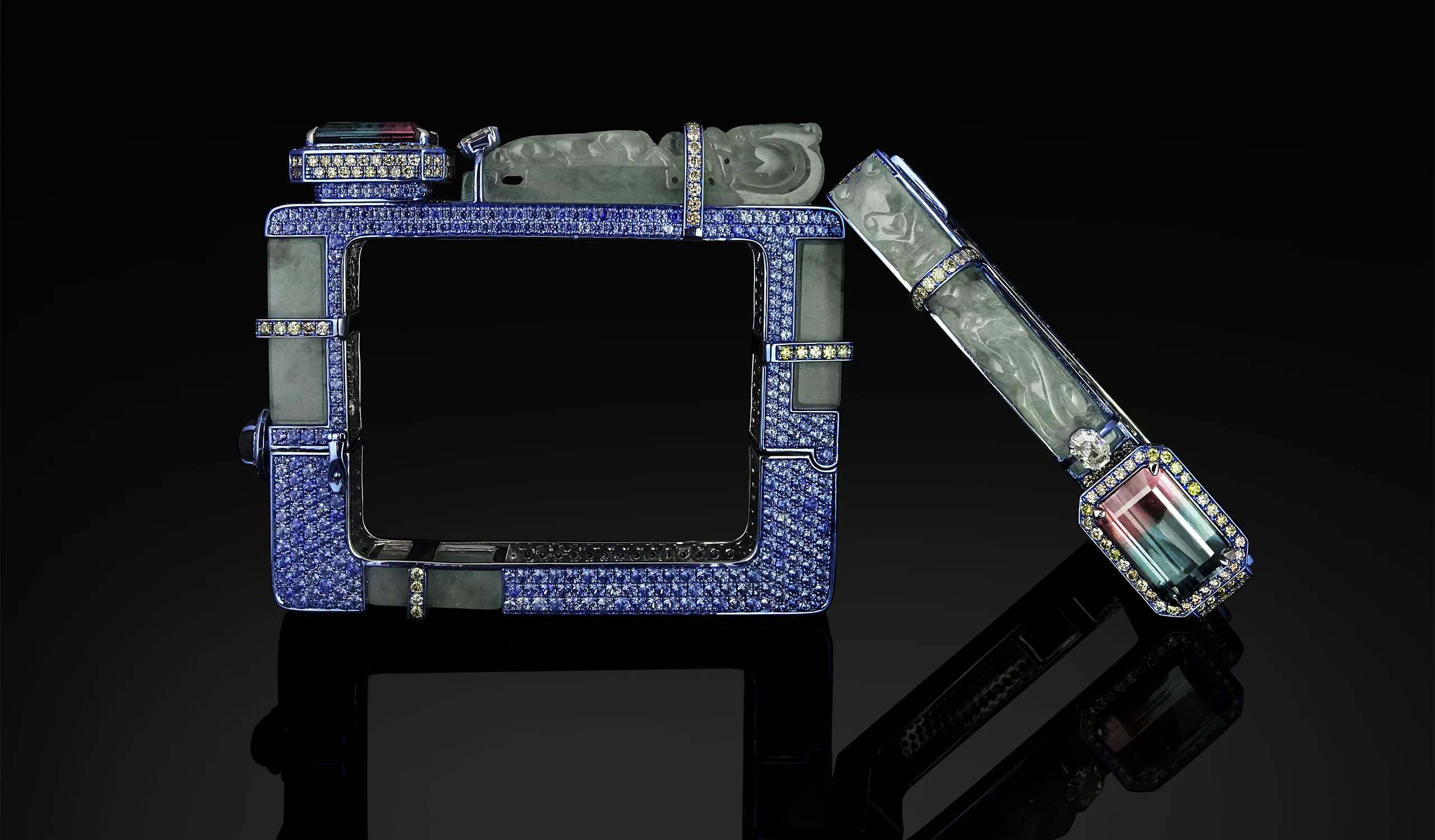 <p>Austy Lee The Dragons’ Gate bangle from The Jade Dynasty collection with Brazilian bi-colour tourmaline, Burmese white jades, blue sapphires, fancy colour diamonds and white diamonds set in 18k white gold </p>