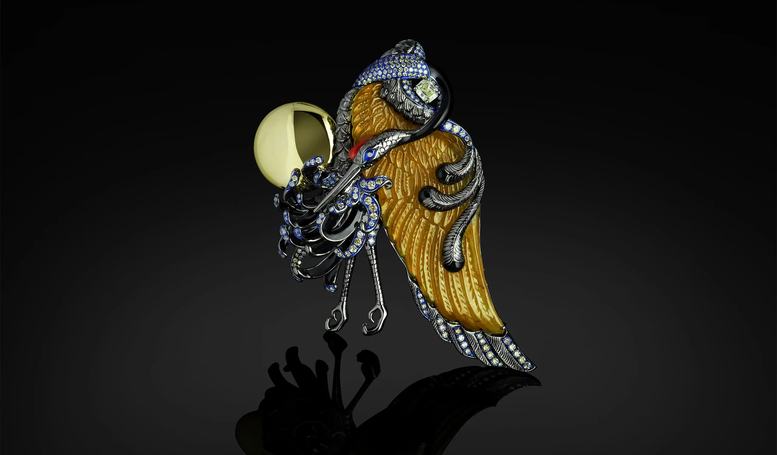 <p>Austy Lee The Crane Dance brooch from The Jade Dynasty collection with Burmese yellow jade, coral, onyx, fancy colour diamonds and white diamonds set in 18k yellow gold </p>