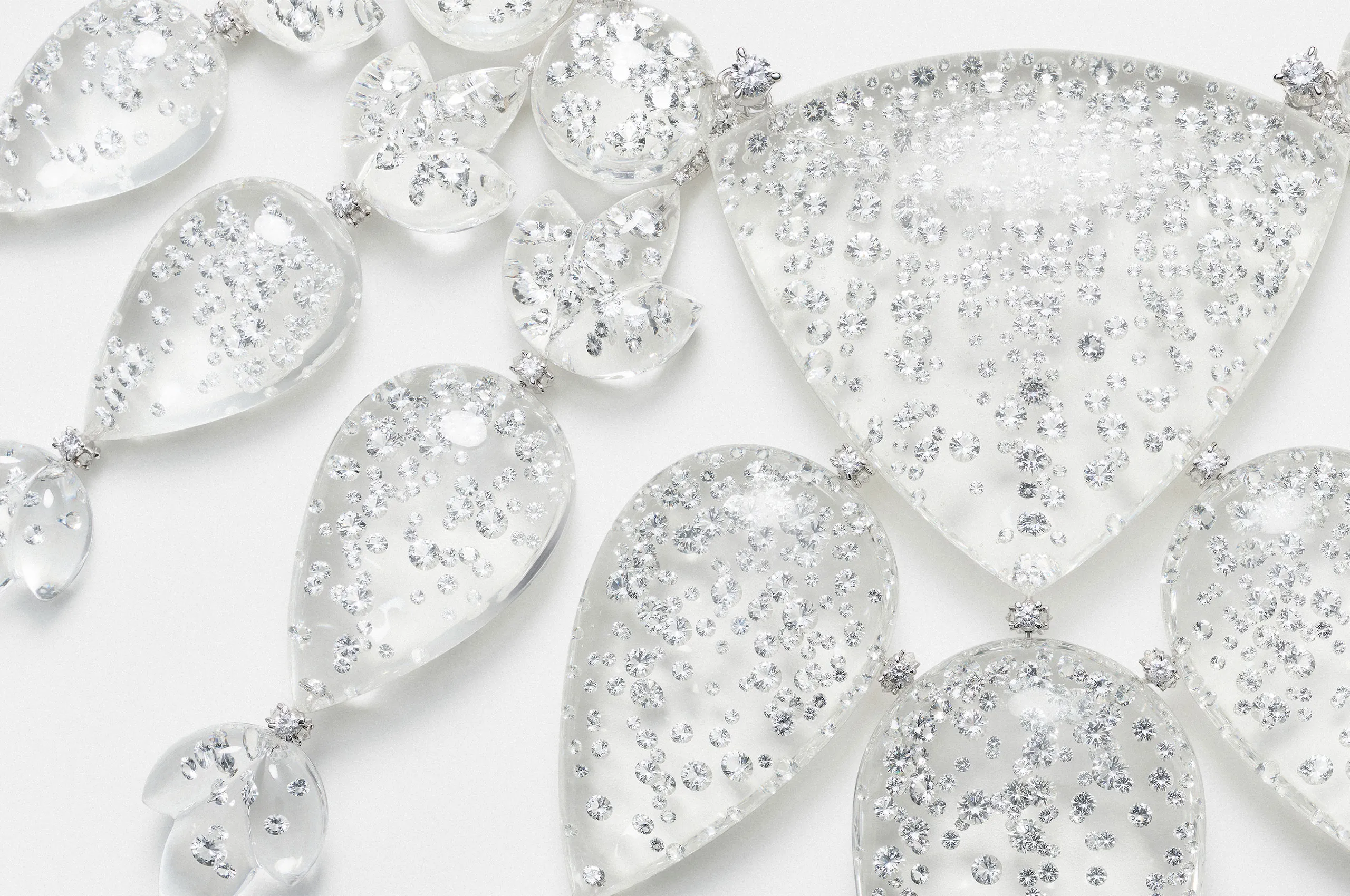 A closer look at the stone-setting details in the Boucheron Rain necklace, crafted with rock crystal and diamonds in white gold from the Human Being Carte Blanche High Jewellery collection