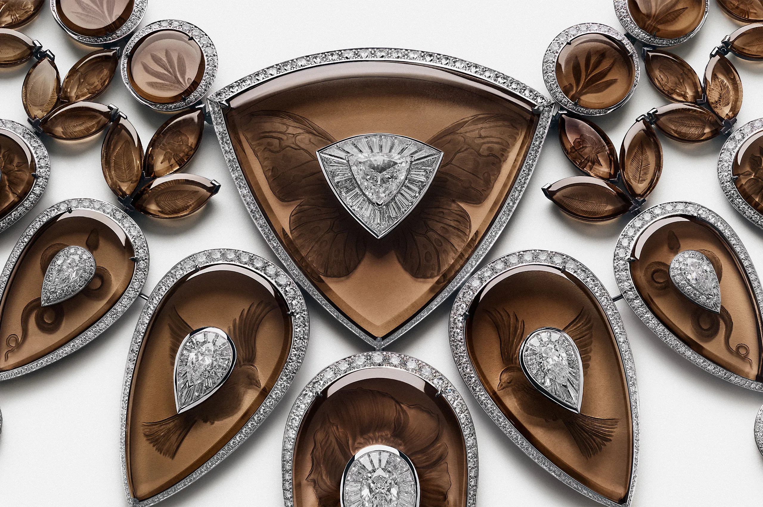 The sculptural composition of Boucheron's Tattoo necklace combines carved smoky quartz with diamond-set forms in a richly layered design.