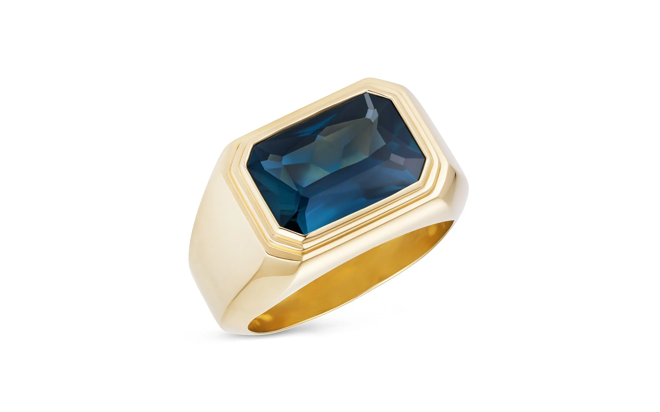 <p>Bear Brooksbank The Solitaire IV ring, set with a 3.50 carat emerald cut teal sapphire in 18K yellow gold</p>
