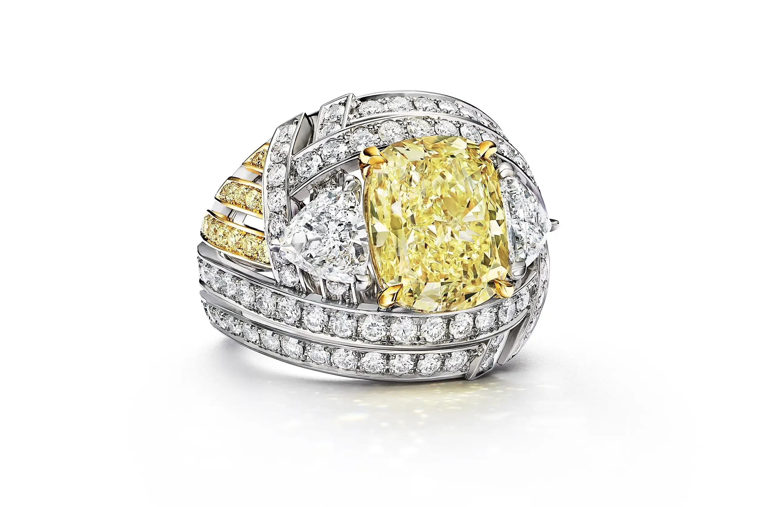 Tiffany & Co. Blue Book Nest ring, set with a 6.26ct cushion-cut, Fancy Intense Yellow diamond, trillion and round white diamonds, and round yellow diamond accents