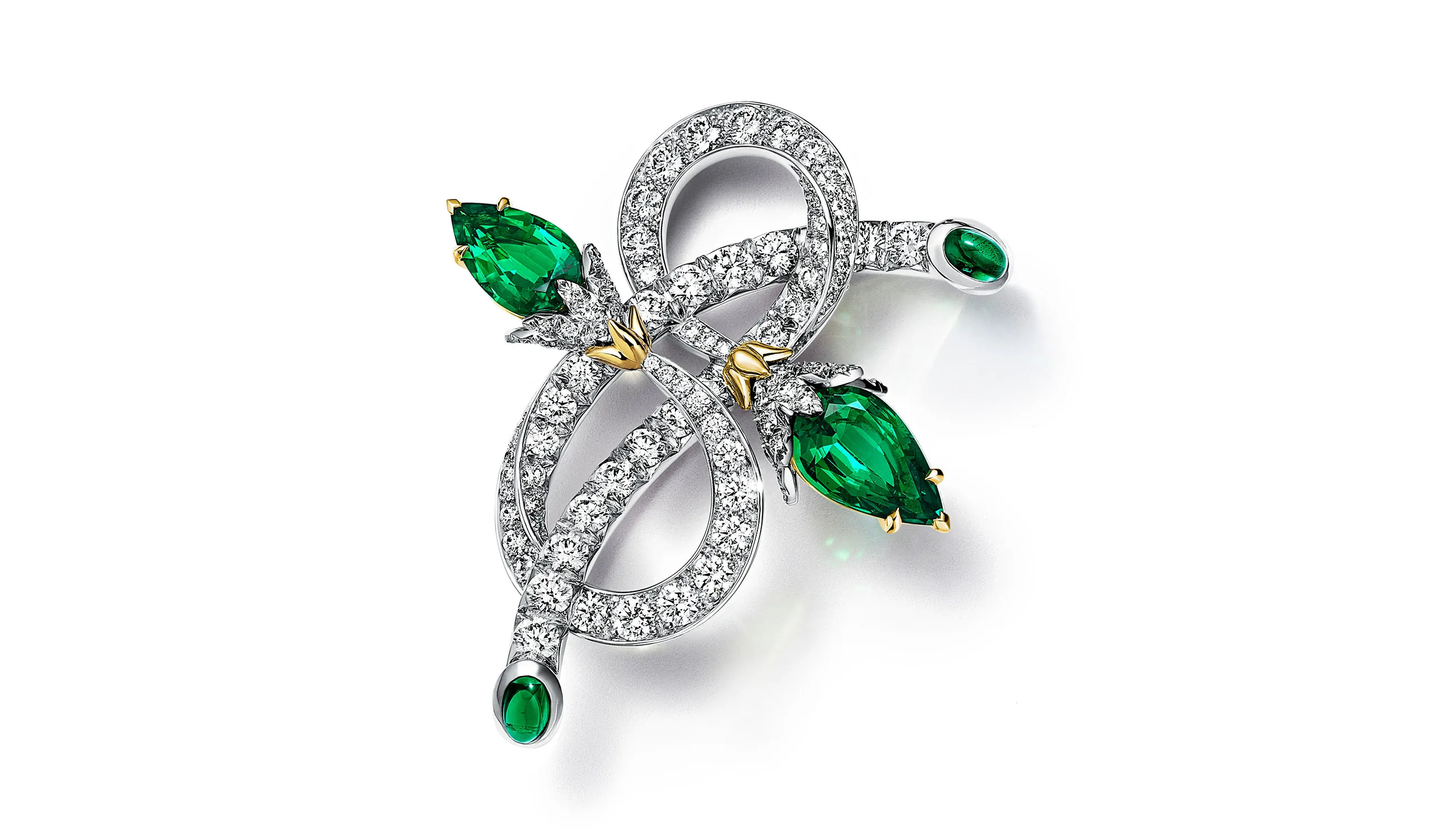 <p>Tiffany &amp; Co. Blue Book Hidden Garden Twin Bud brooch in platinum and 18k yellow gold with two unenhanced pear-shaped emeralds of 2.31ct, oval cabochon emerald accents and diamonds</p>
