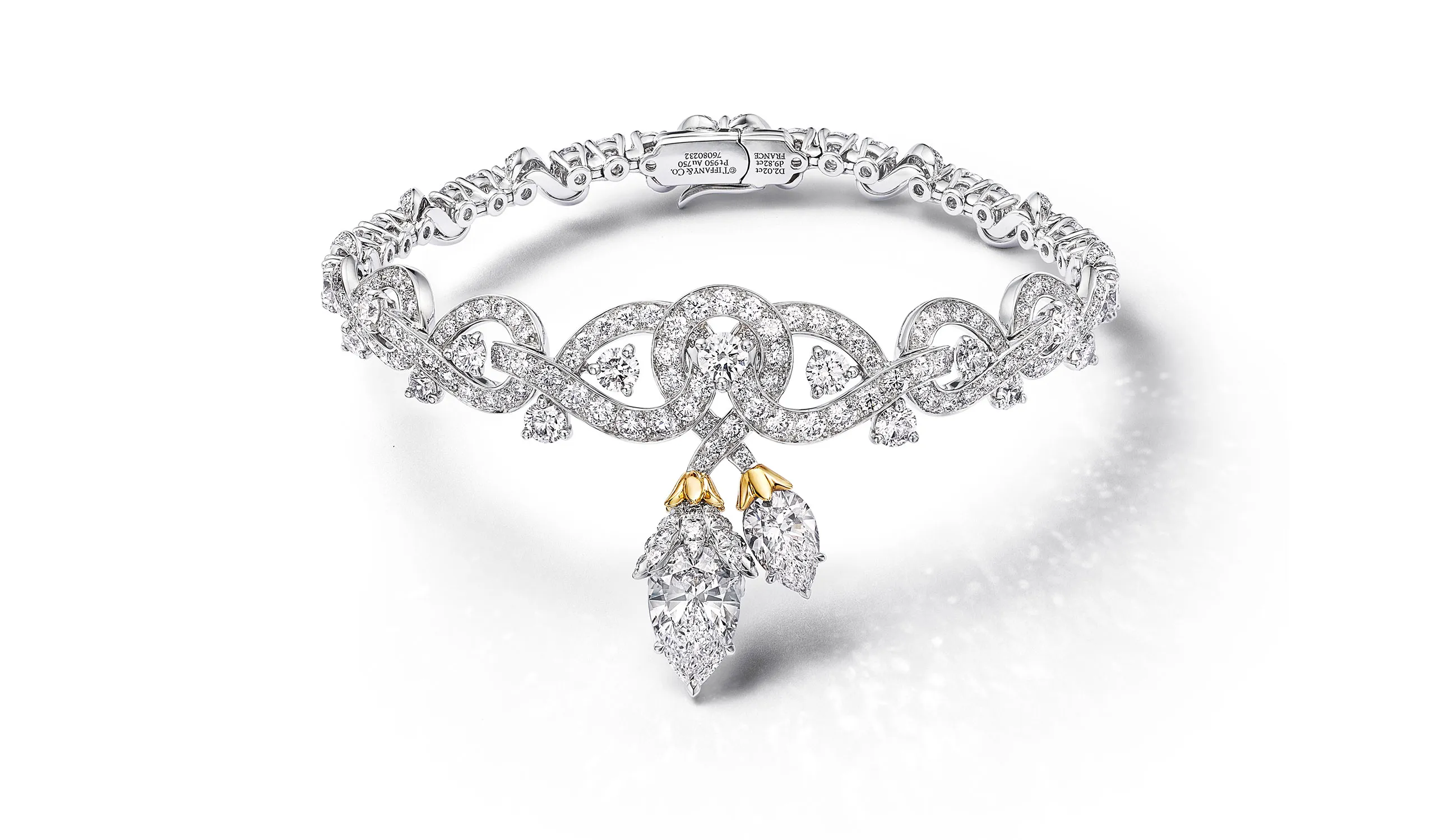 <p>Tiffany &amp; Co. Blue Book Hidden Garden Twin Bud bracelet in platinum and 18k yellow gold with a 2.02ct pear-shaped diamond and diamond accents</p>
