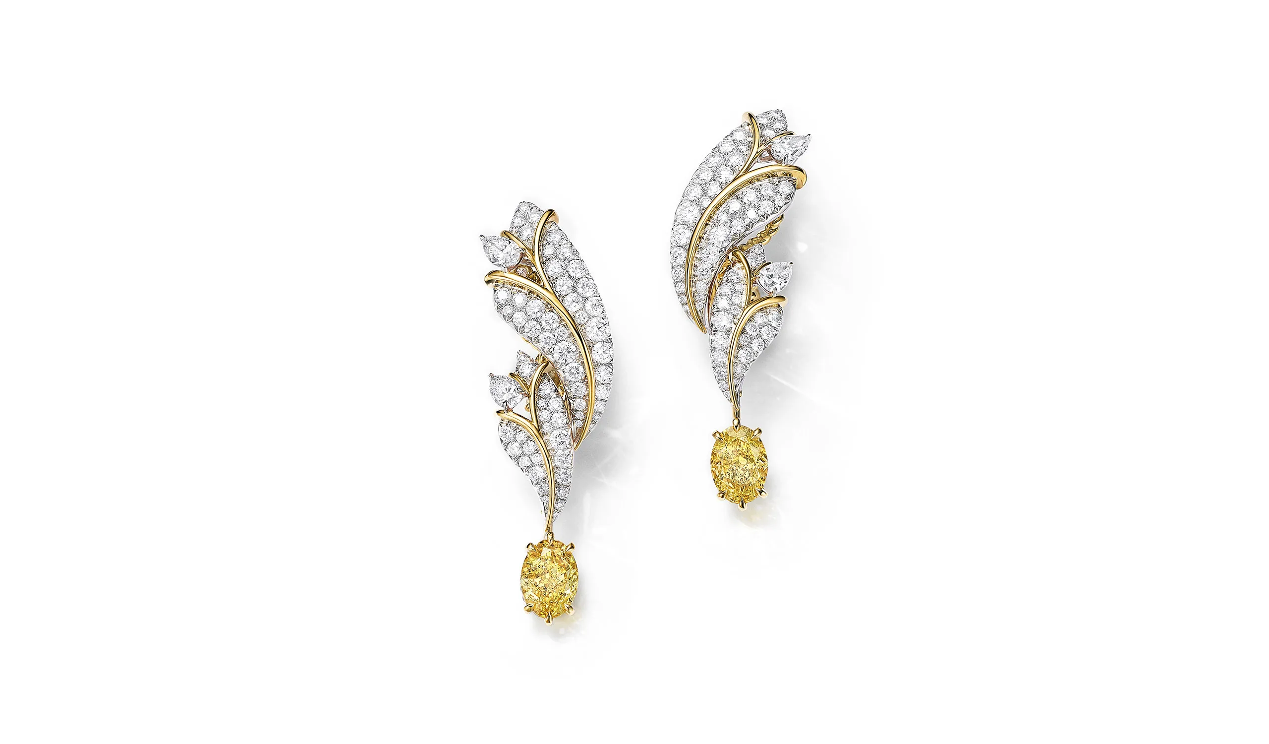 <p>Tiffany &amp; Co. Blue Book Hidden Garden Butterfly earrings in platinum and 18k yellow gold with two oval Fancy Vivid Yellow diamonds totalling 3.62 carats and white diamonds</p>
