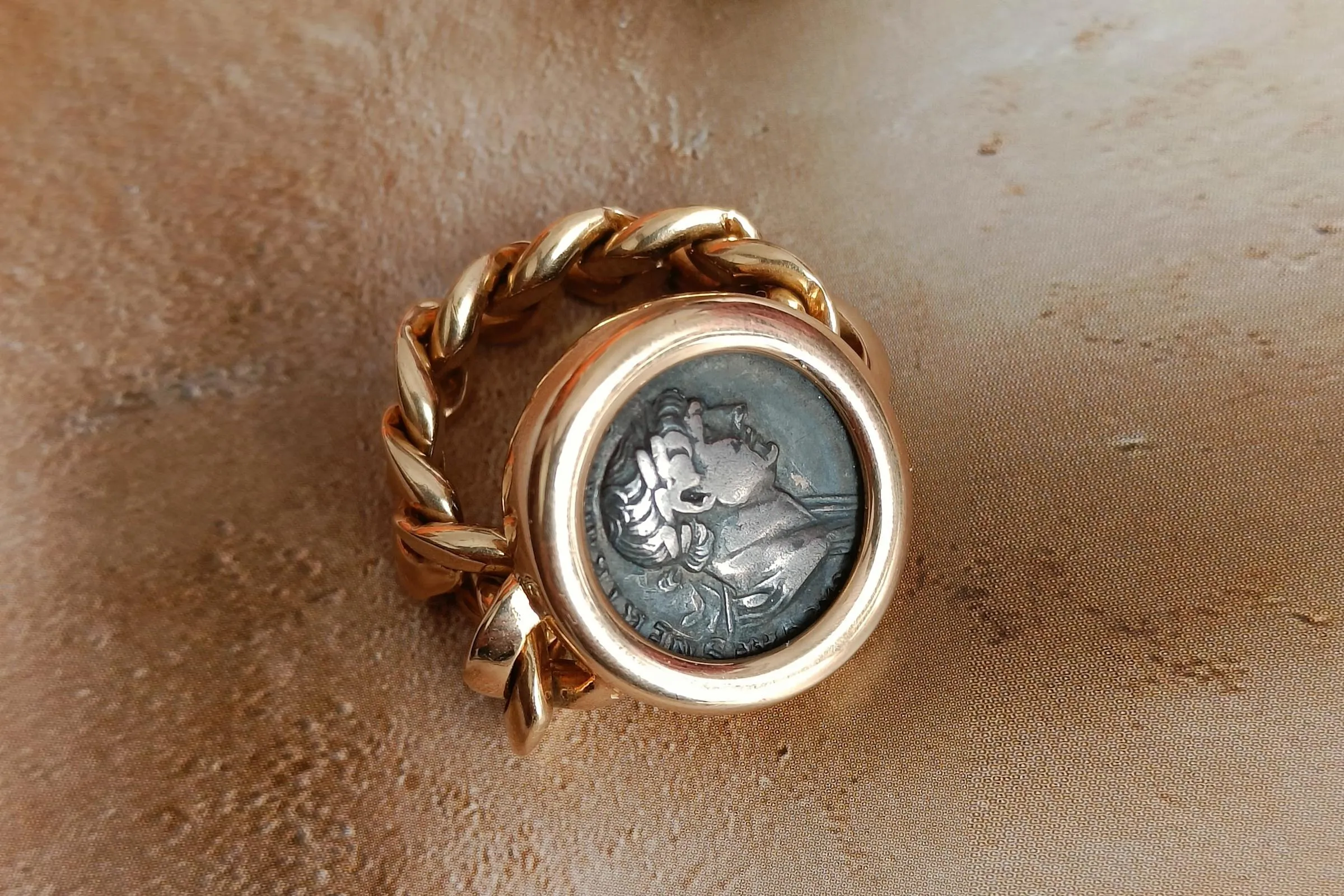 <p>Bulgari ‘Monete’ Gold Ring with antique silver coins</p>