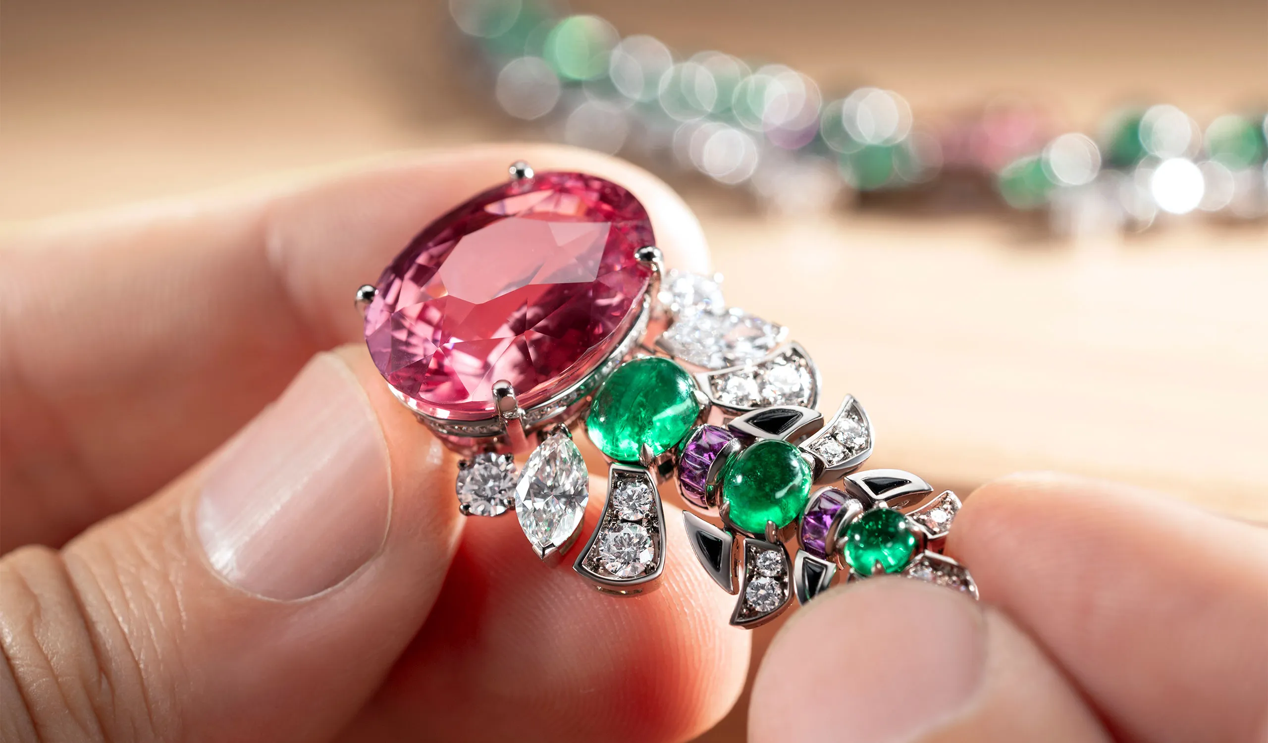 <p>Setting the 26.65ct oval Padparadscha sapphire in the Eclettica Secret Garden high jewellery necklace</p>
