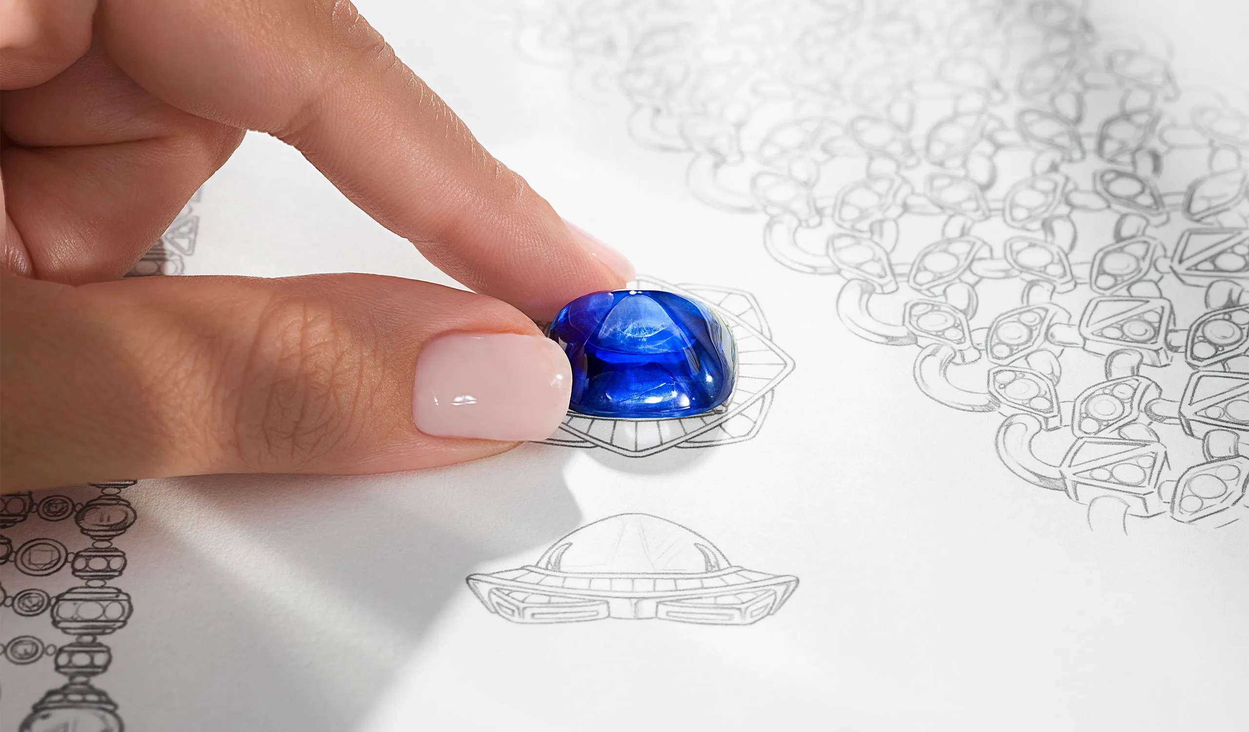 <p>Exploring design options with the sugarloaf cabochon sapphire centre stone</p>
