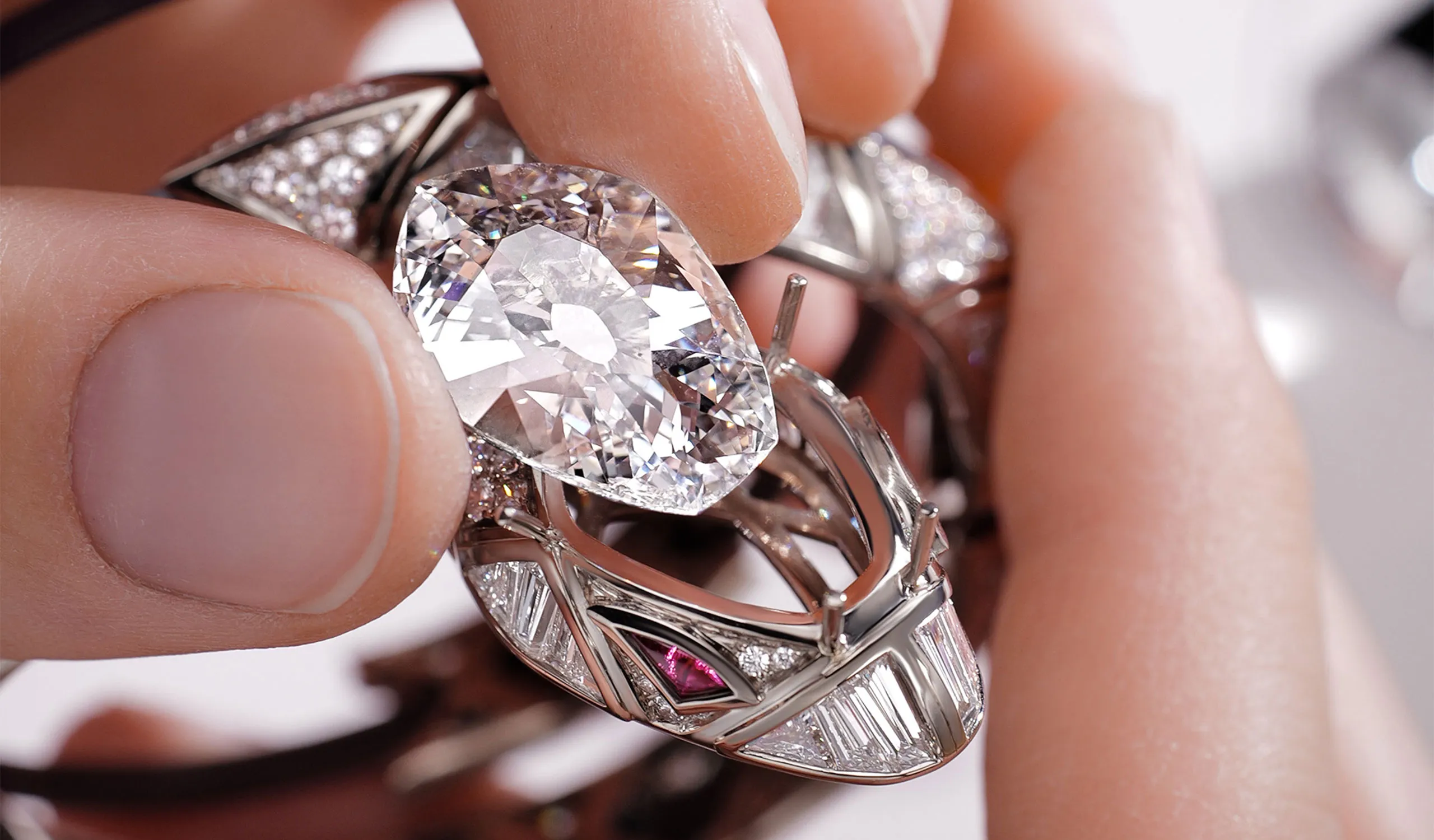 <p>Setting a 7.49ct (D IF) modified shield-cut diamond in the snake’s head</p>
