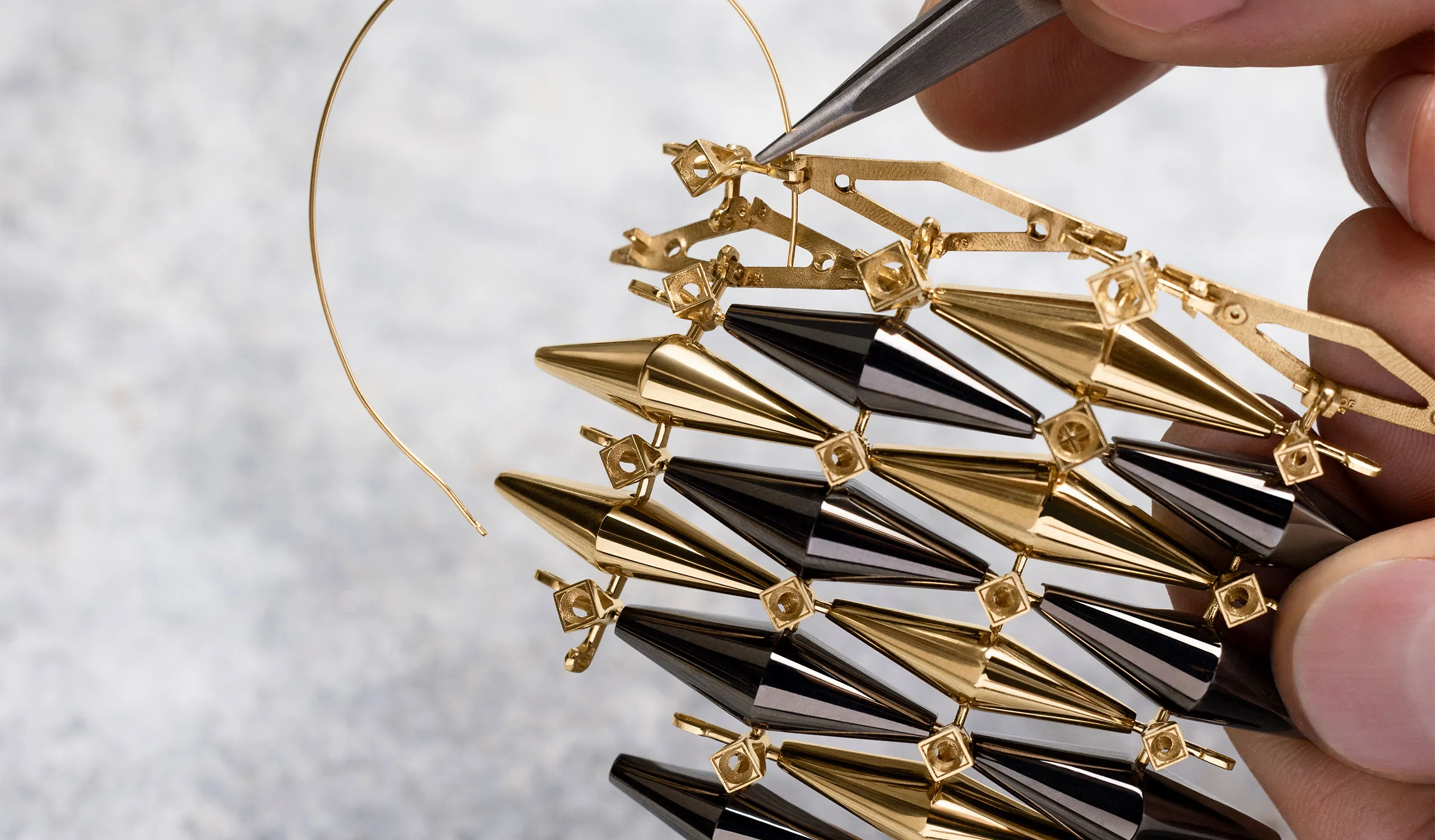 <p>The velvety black of Diamond-Like Carbon (DLC) sets up a graphic dialogue with yellow gold and diamonds in the Bvlgari Eternal – Vimini high jewellery designs</p>
