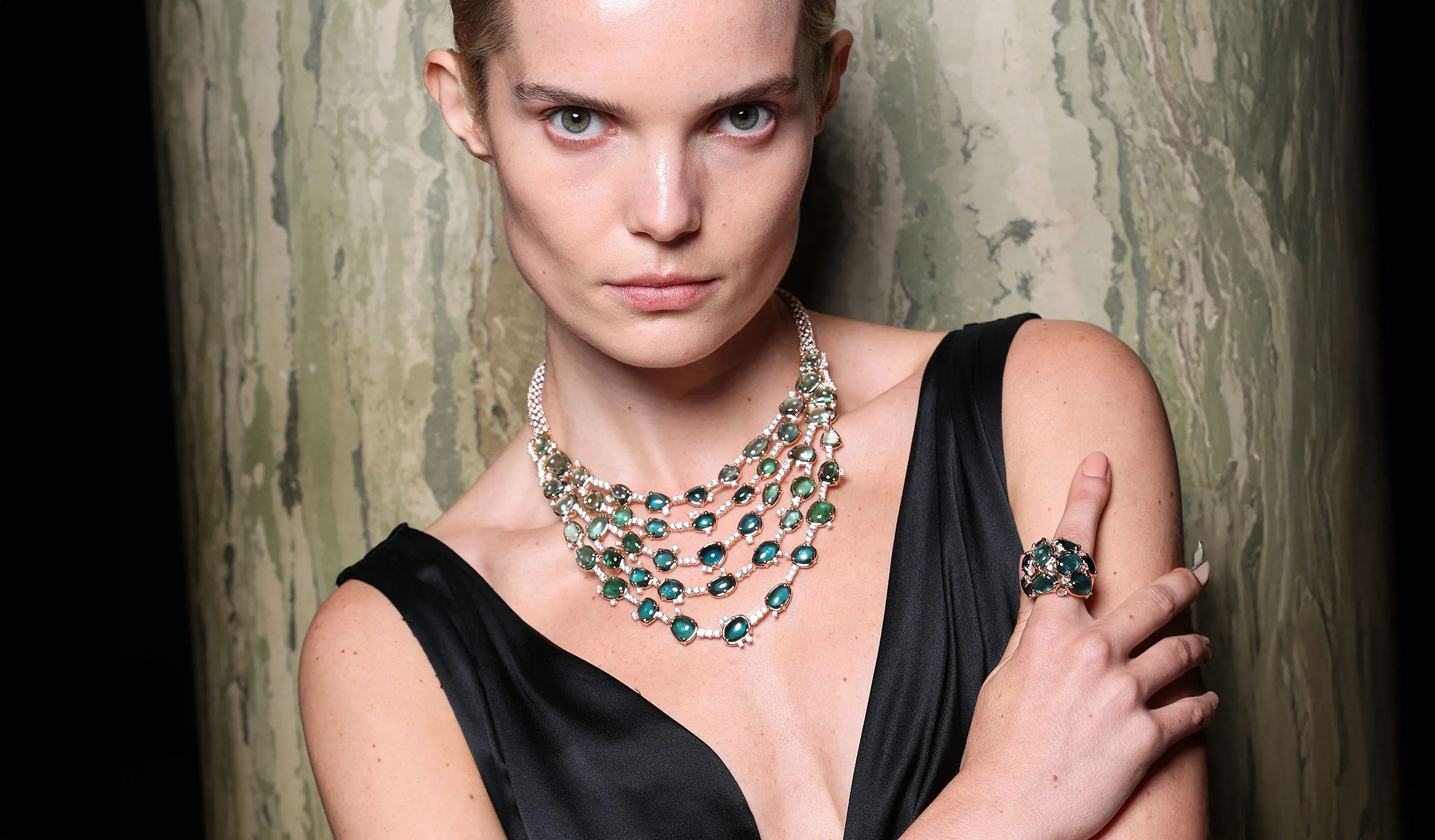 <p>A model wears the Pomellato Lagoon Bavarole necklace with 47 irregular cut green tourmalines on a diamond pavé-set rope chain, part of the ‘Collezione 1967’ High Jewellery collection</p>